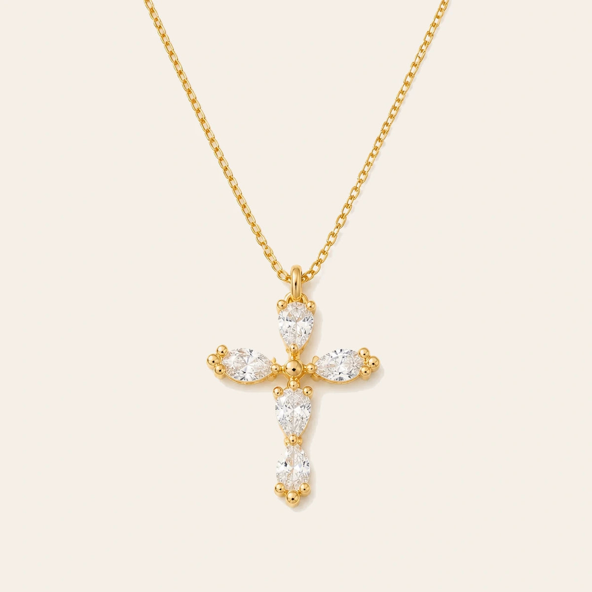 Amada Dainty Crystal Cross Necklace on ivory background