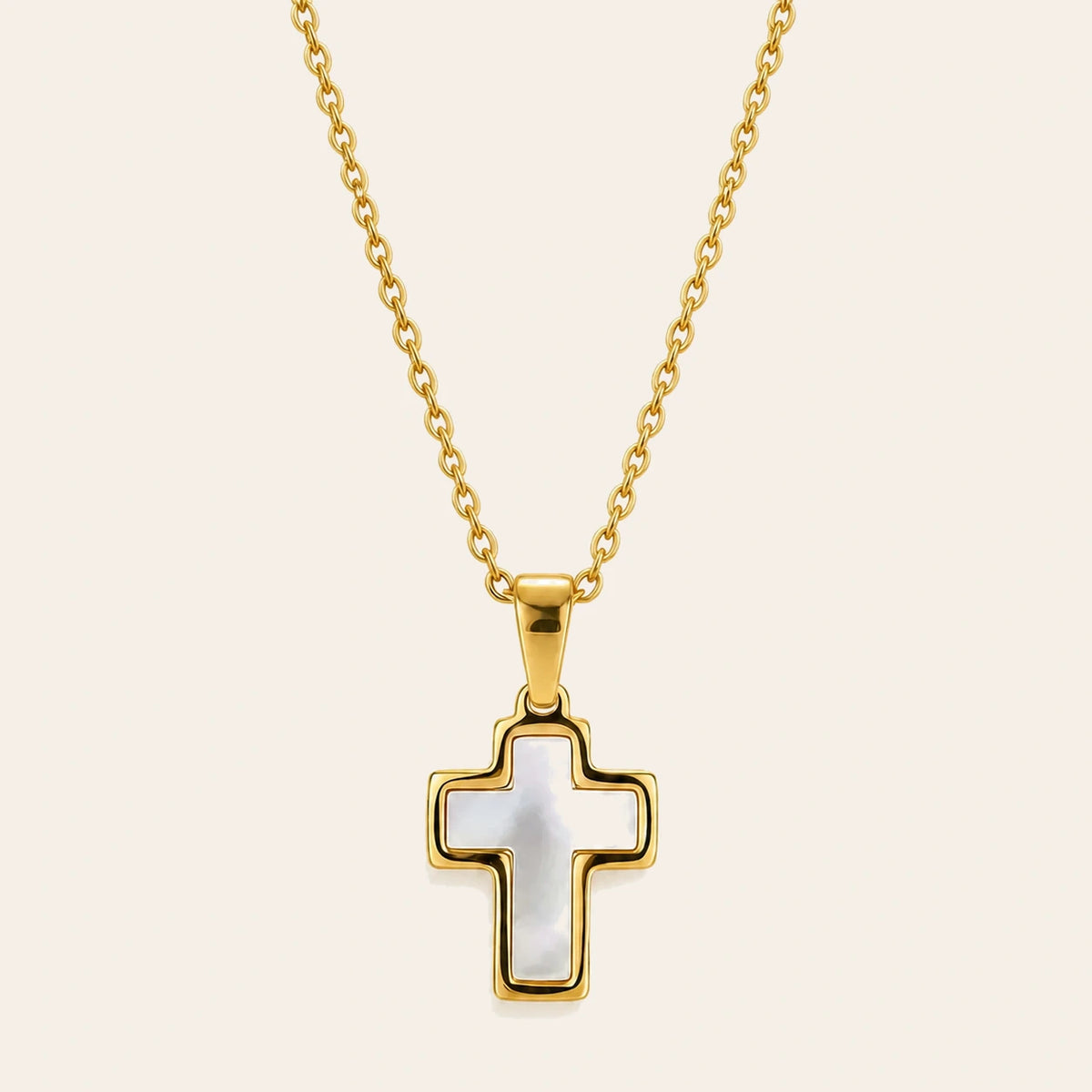 Amada Mother of Pearl Cross Necklace on ivory background