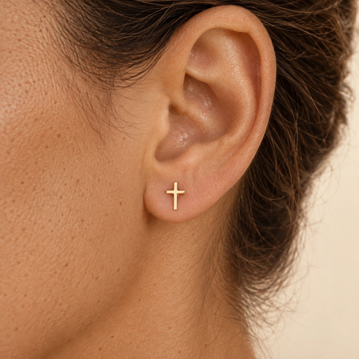 The Cross Studs worn, gold-plated stainless steel