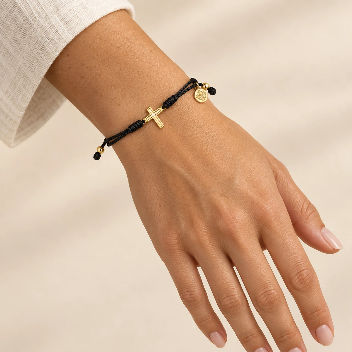 The Faith Bracelet worn, gold-plated stainless steel