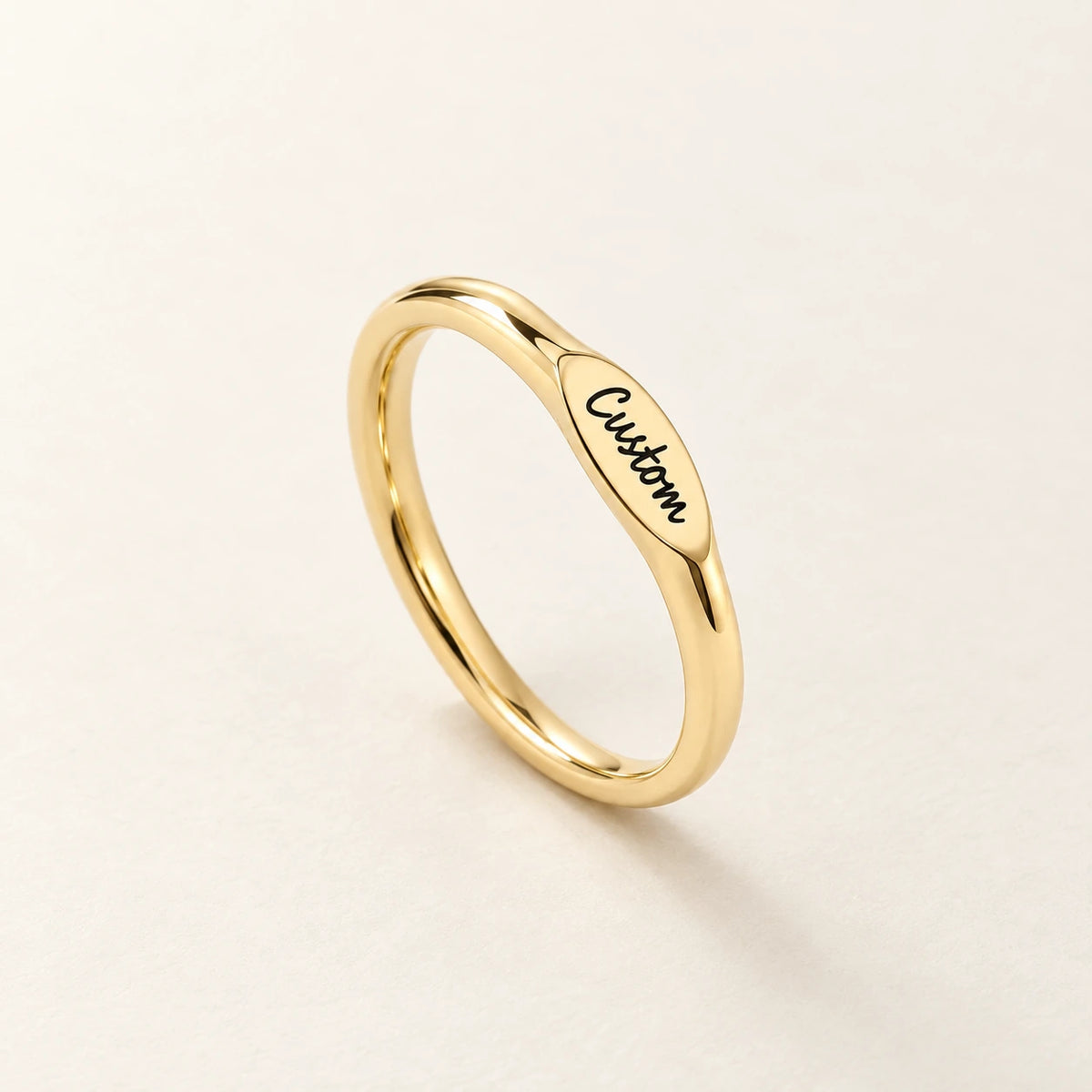 The Initial Ring, gold-plated stainless steel, shown on its own