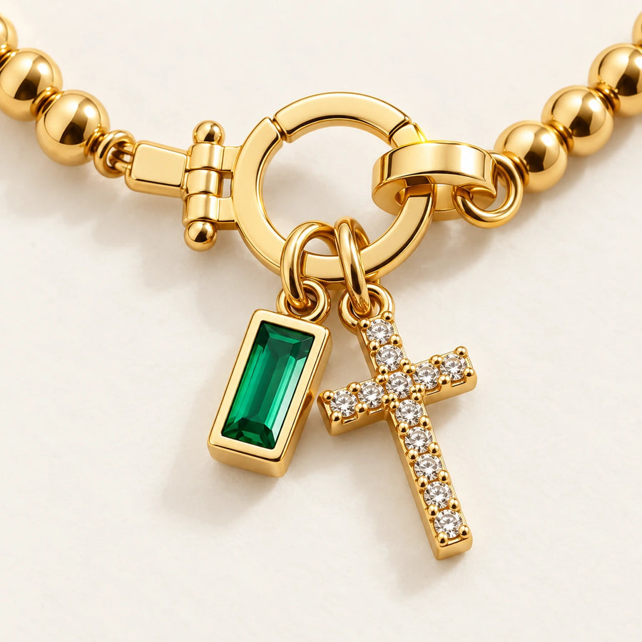Close detail of Birth Month Crystal Cross Charm Bracelet
