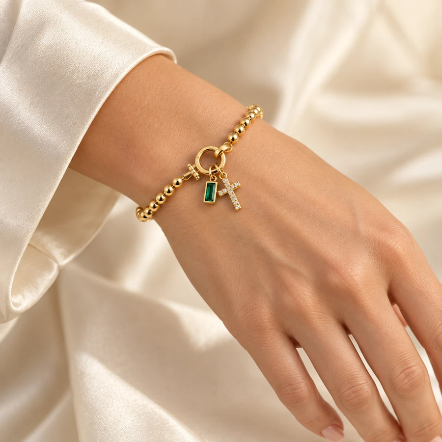 Birth Month Crystal Cross Charm Bracelet styled with other pieces