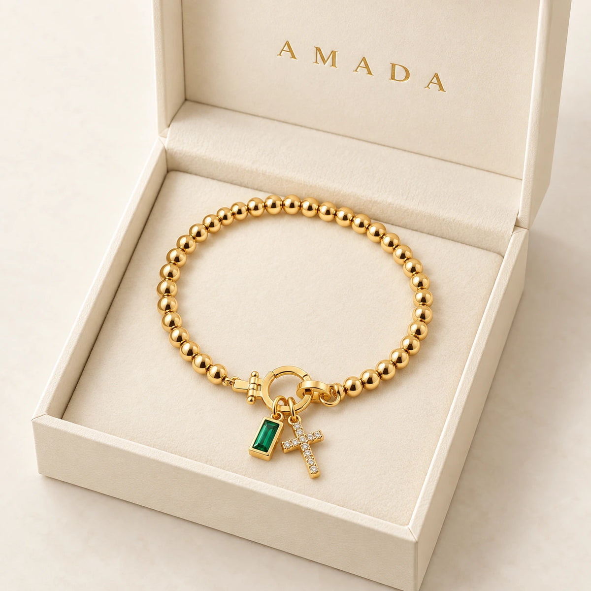 Birth Month Crystal Cross Charm Bracelet presented in an Amada box