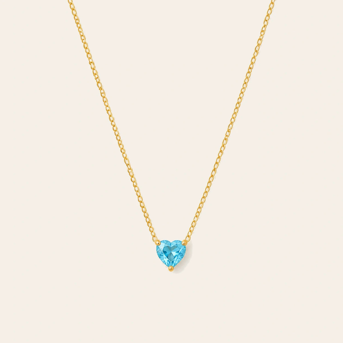 Amada Birthstone Heart Necklace on ivory background