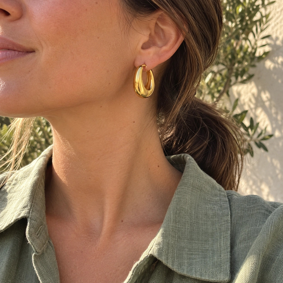 Amada Chunky Hoop Earrings worn in an everyday setting.