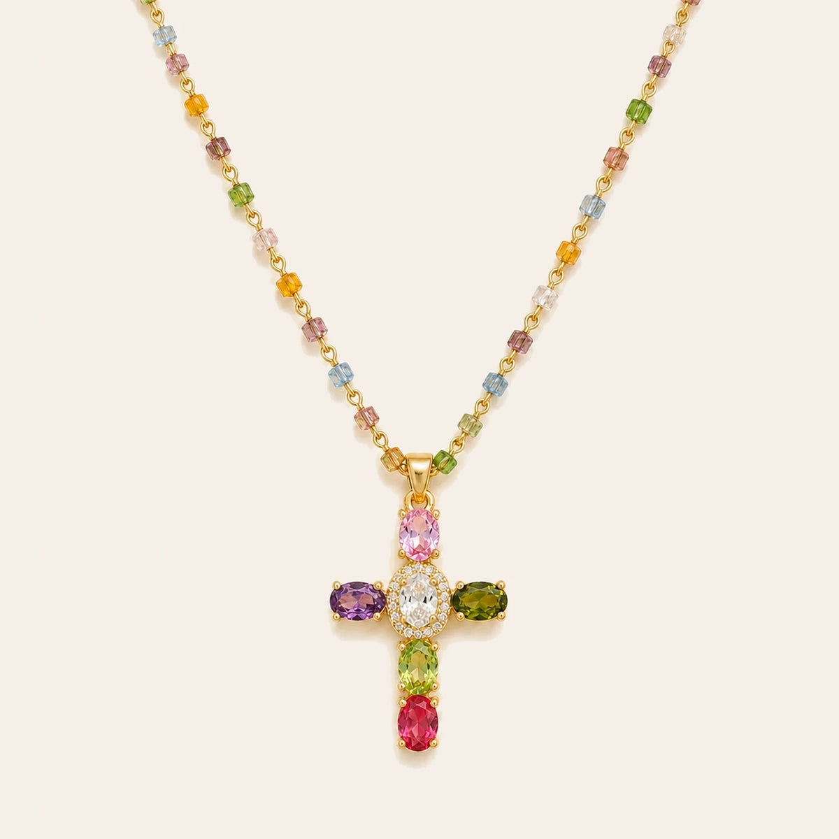 Amada Colorful Crystal Cross Necklace on ivory background