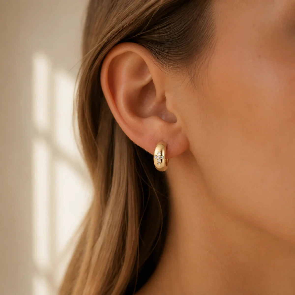 Amada Q4 lifestyle | Cross Huggie Earrings