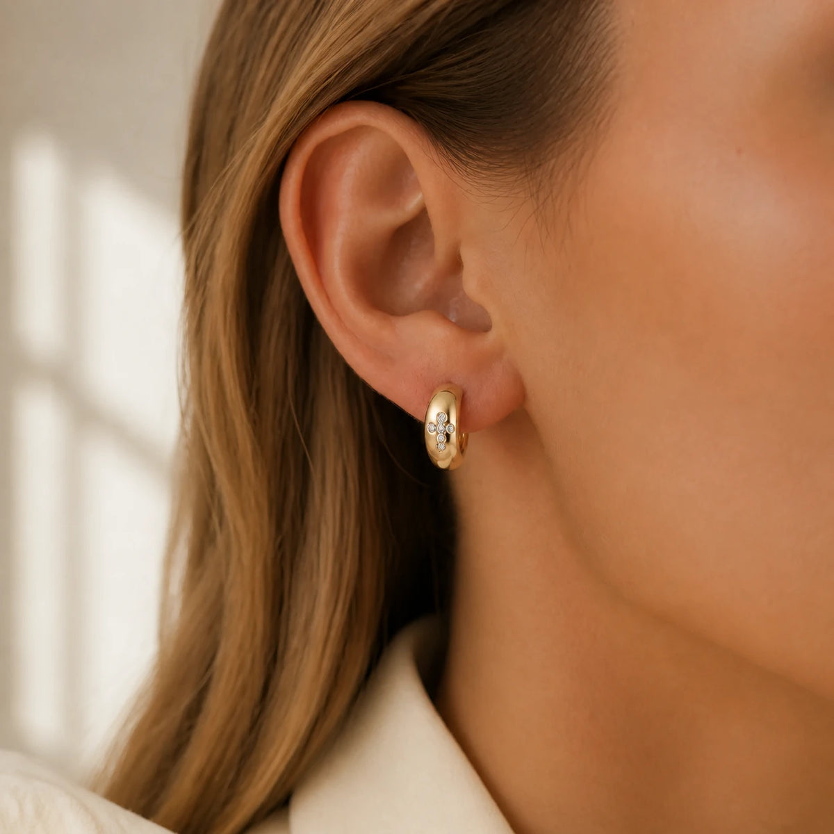 Amada | Cross Huggie Earrings | high definition campaign model | cycle 17 quality