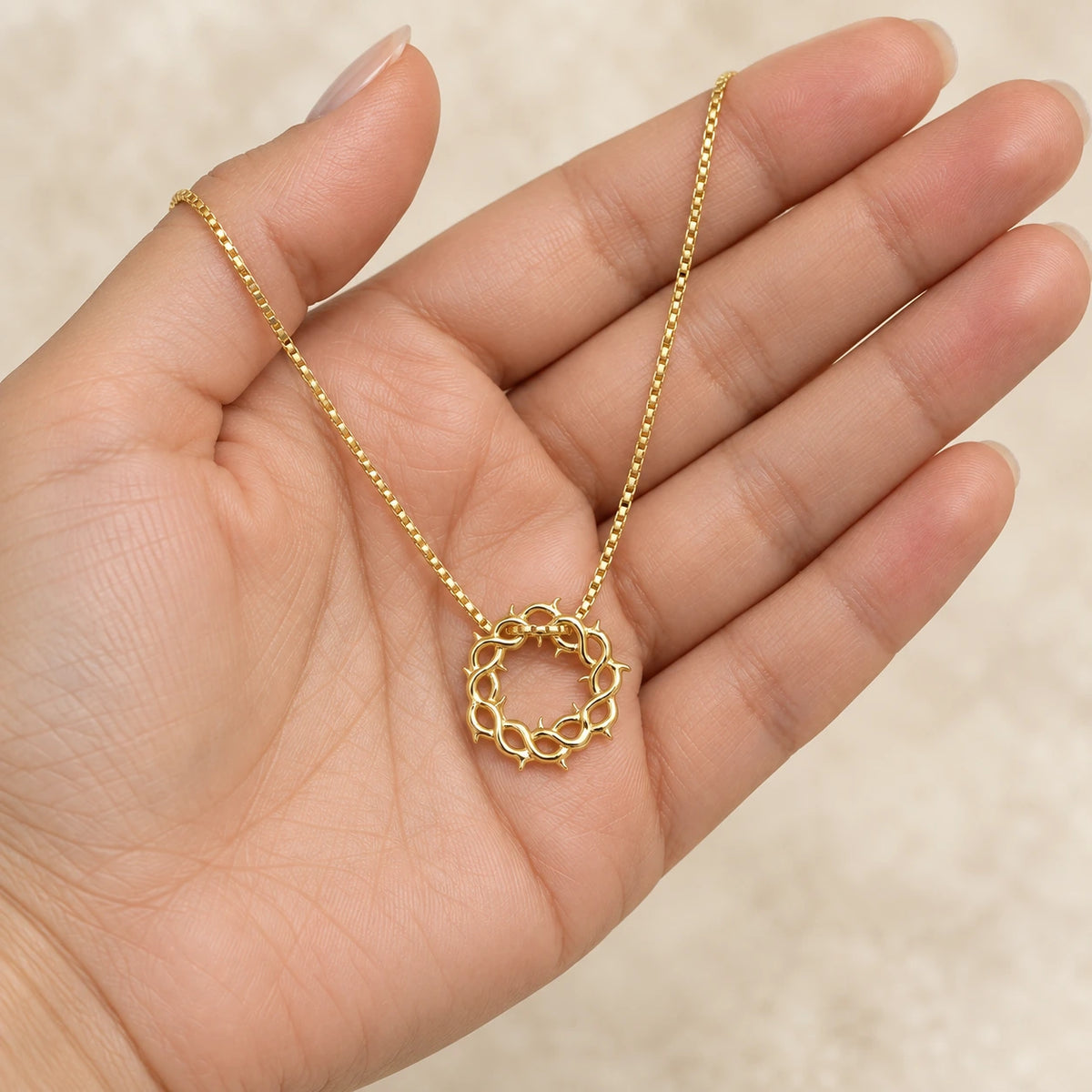 Crown of Thorns Necklace held in hand, showing its true scale