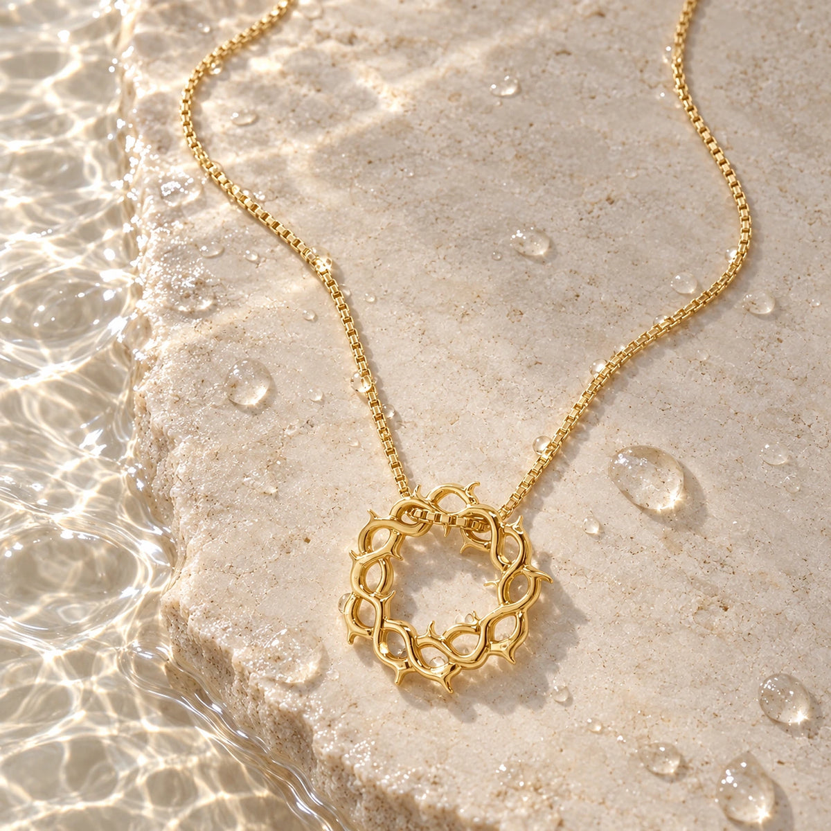 Crown of Thorns Necklace with water droplets on stone
