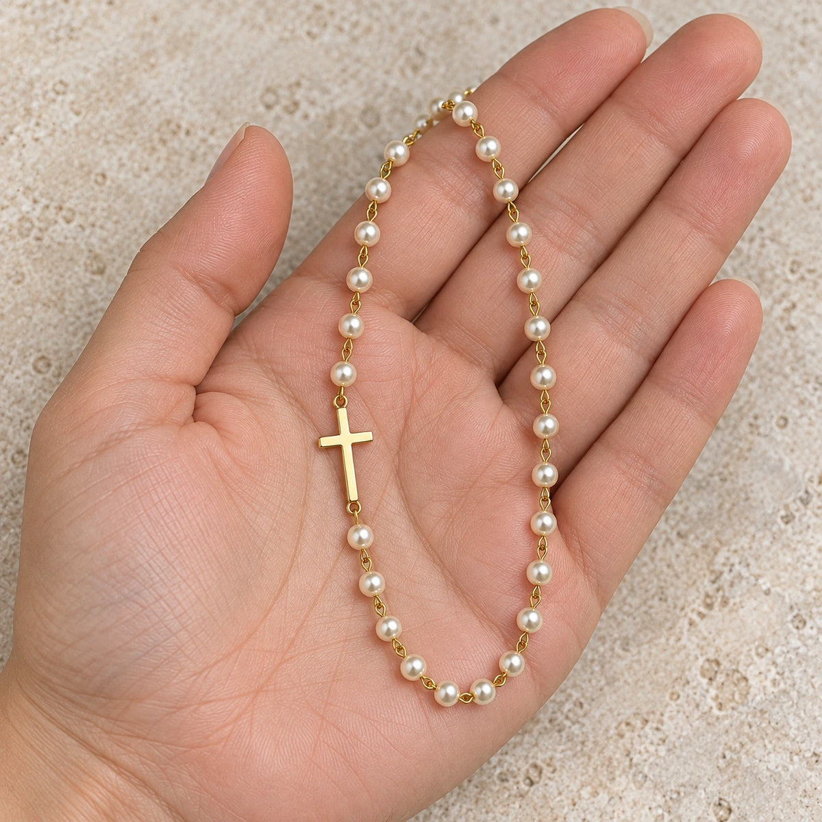 Dainty Faux Pearl Necklace held in hand, showing its true scale