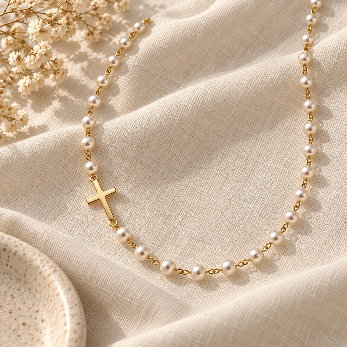 Dainty Faux Pearl Necklace laid flat on linen