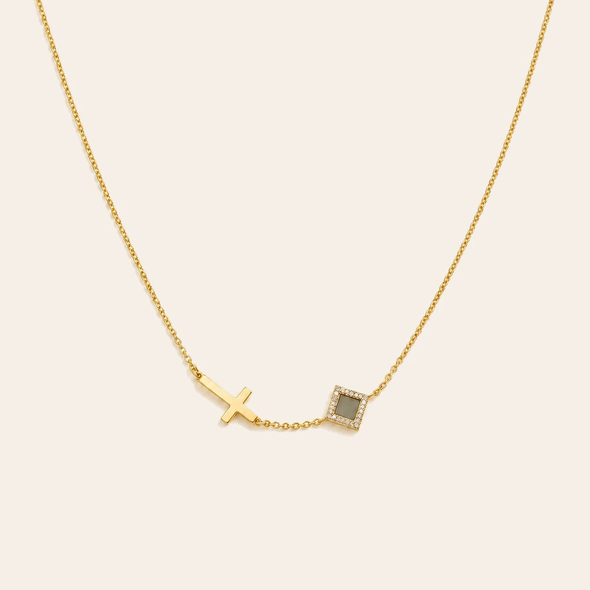 Amada Faith Cross Necklace on ivory background