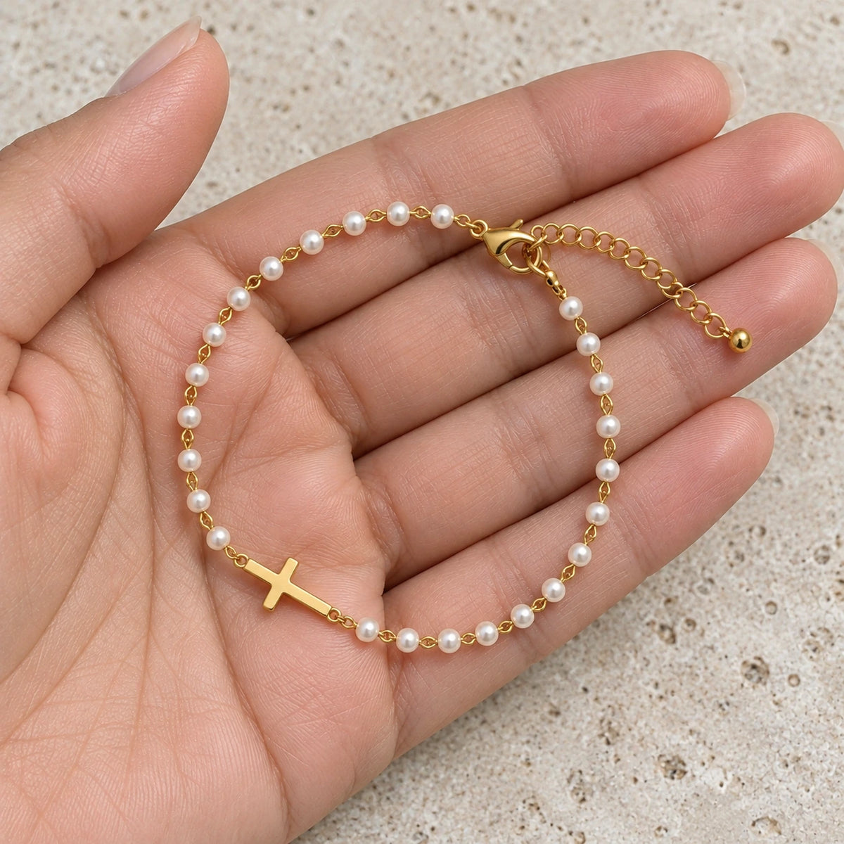 Grace Pearl Bracelet held in hand, showing its true scale