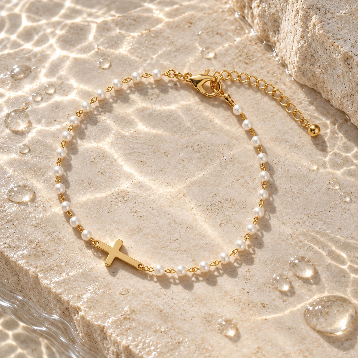 Grace Pearl Bracelet with water droplets on stone
