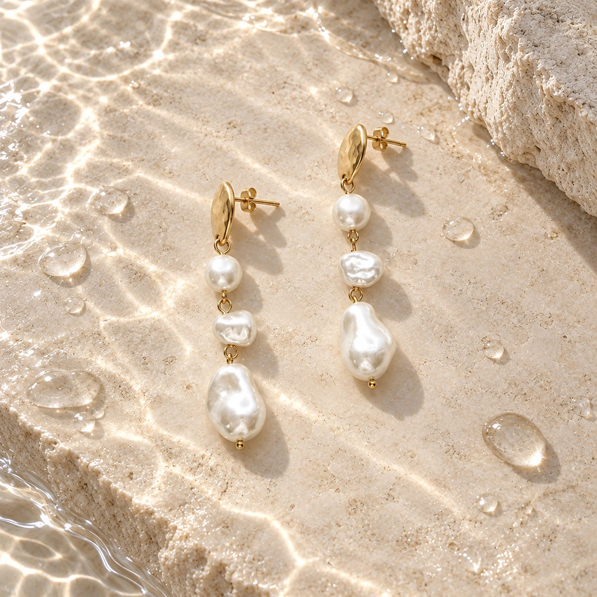 Grace Faux Pearl Drop Earrings with water droplets on stone