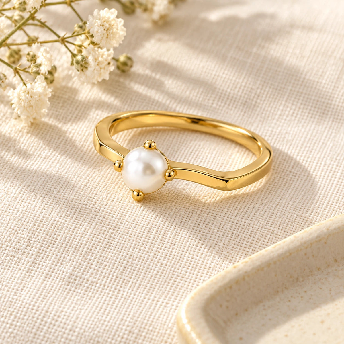 Grace Faux Pearl Ring laid flat on linen
