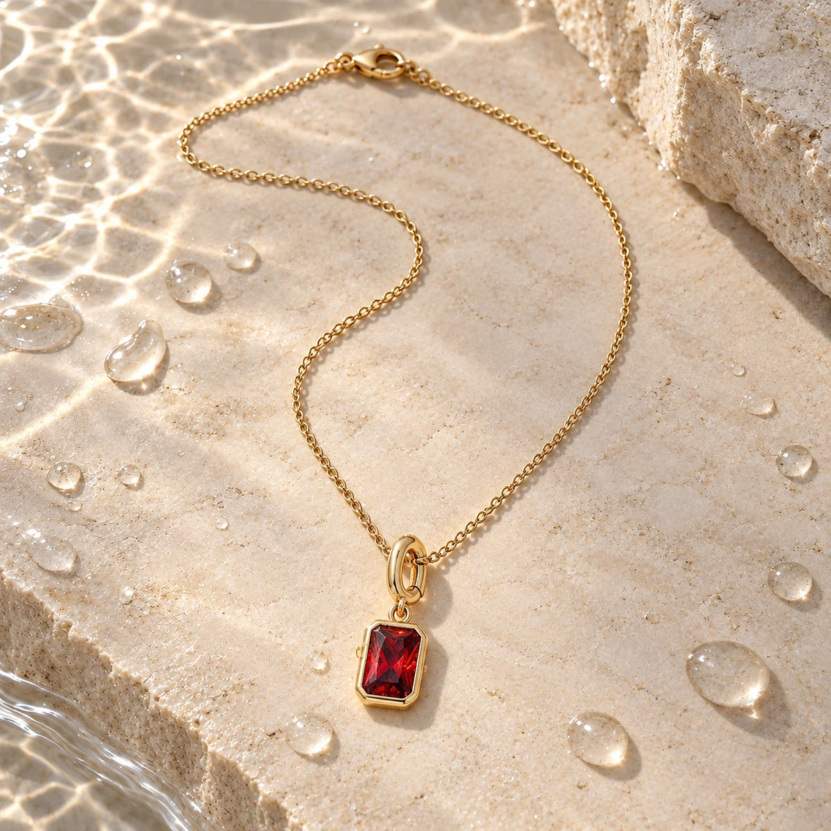 Her Birth Month Charm with water droplets on stone