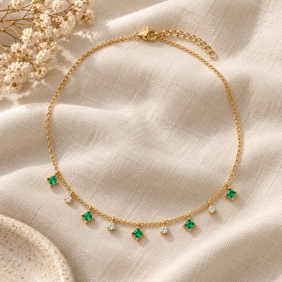 Her Family Necklace laid flat on linen