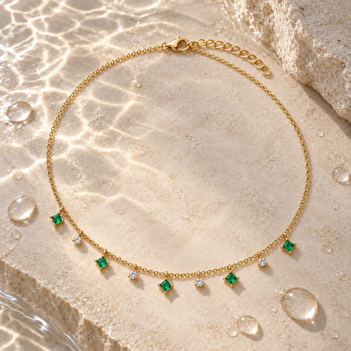 Her Family Necklace with water droplets on stone
