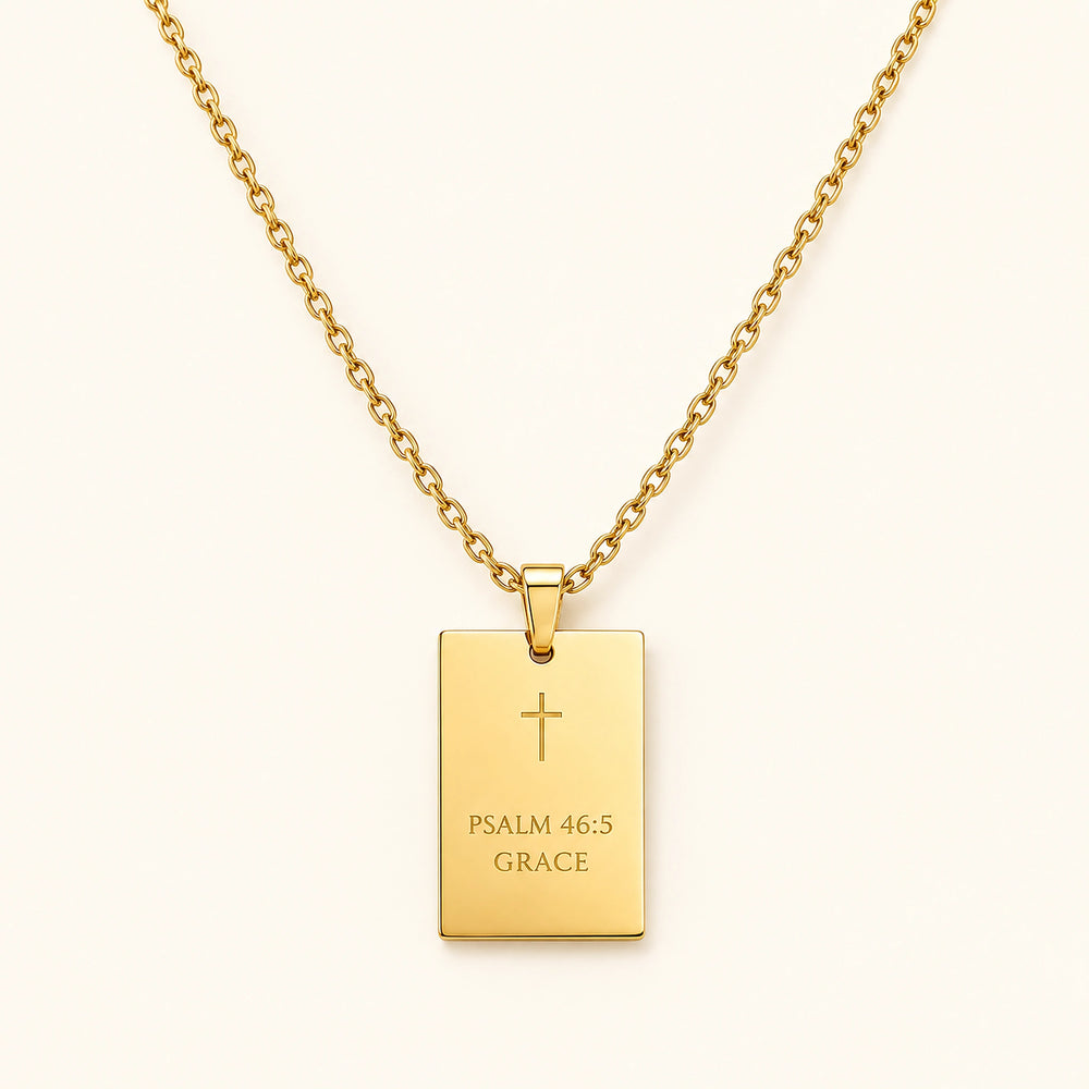 Gold-plated scripture pendant worn close to the heart