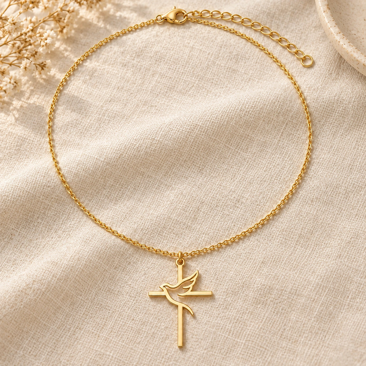 Amada Holy Spirit Dove Necklace laid flat on fabric.