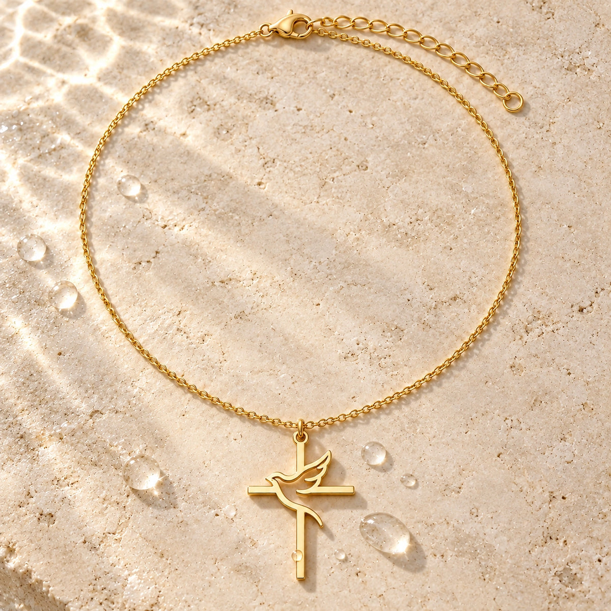 Amada Holy Spirit Dove Necklace in a styled still life with water droplets.