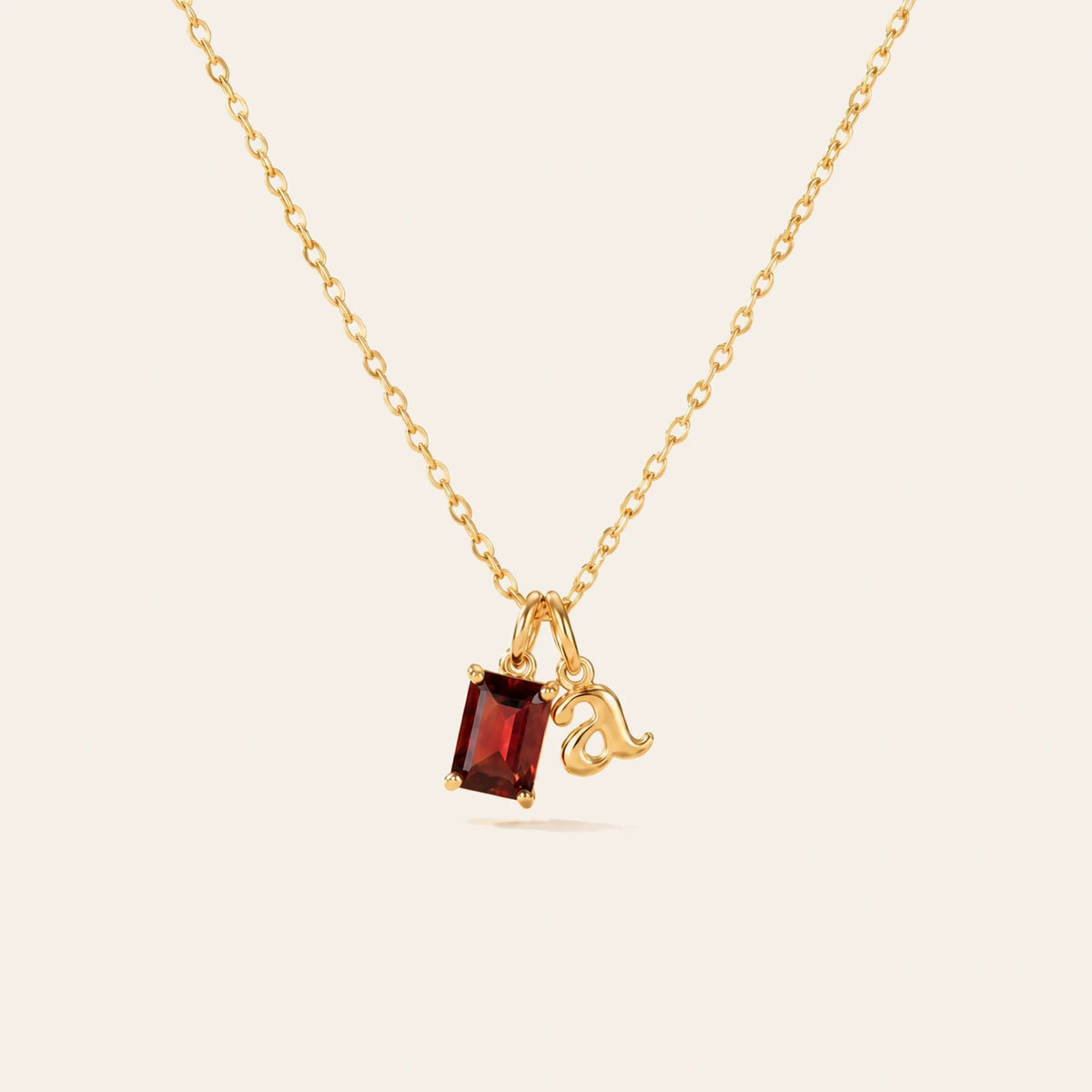Amada Initial & Birthstone Necklace on ivory background