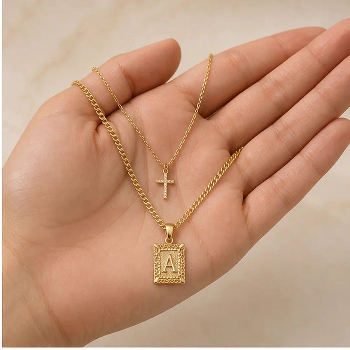 Amada | Initial & Cross Necklace Set | scale in hand | cycle 3