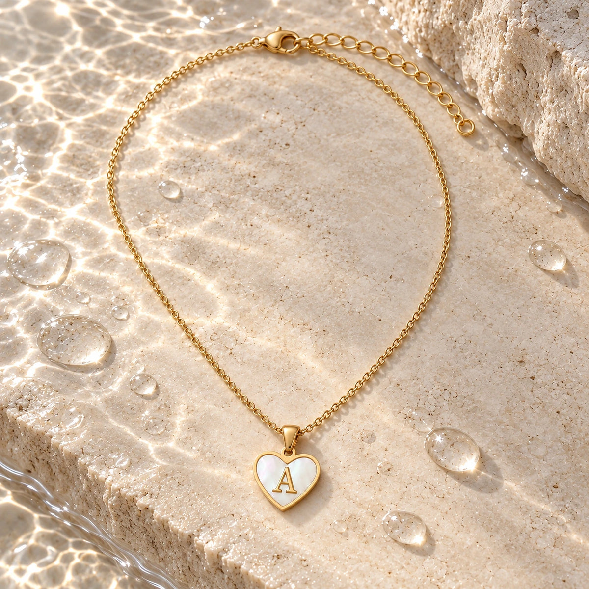 Initial Heart Necklace with water droplets on stone