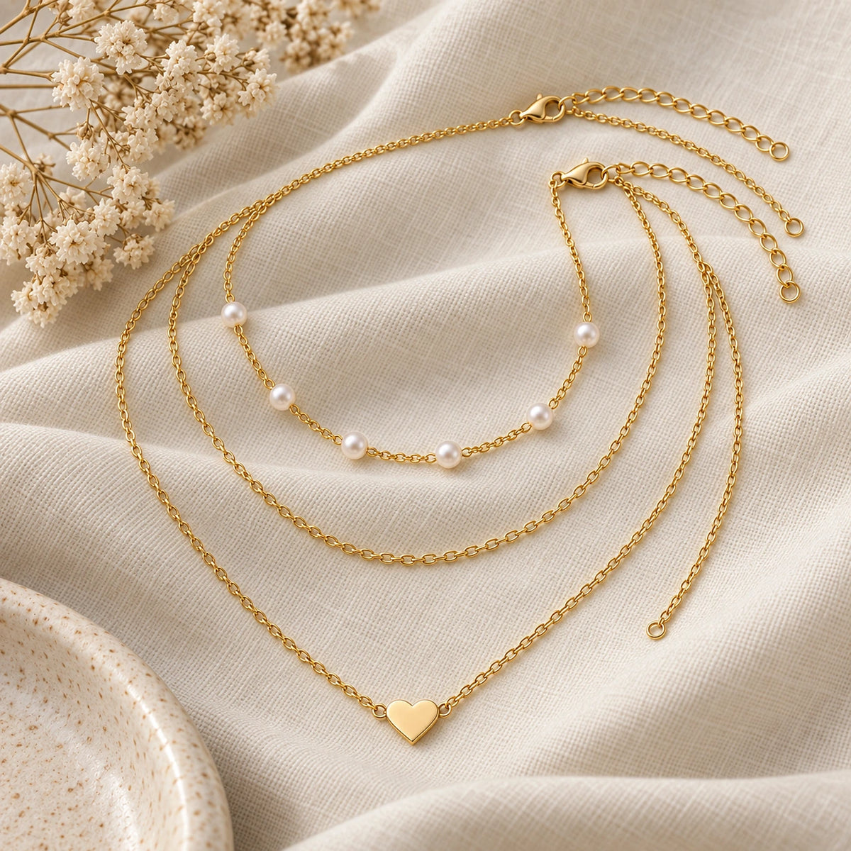 Layered Faux Pearl Necklace Set laid flat on linen
