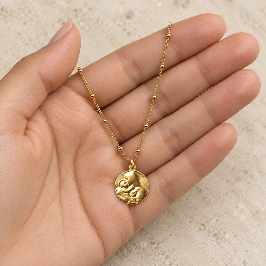 Mother Mary Necklace shown for scale