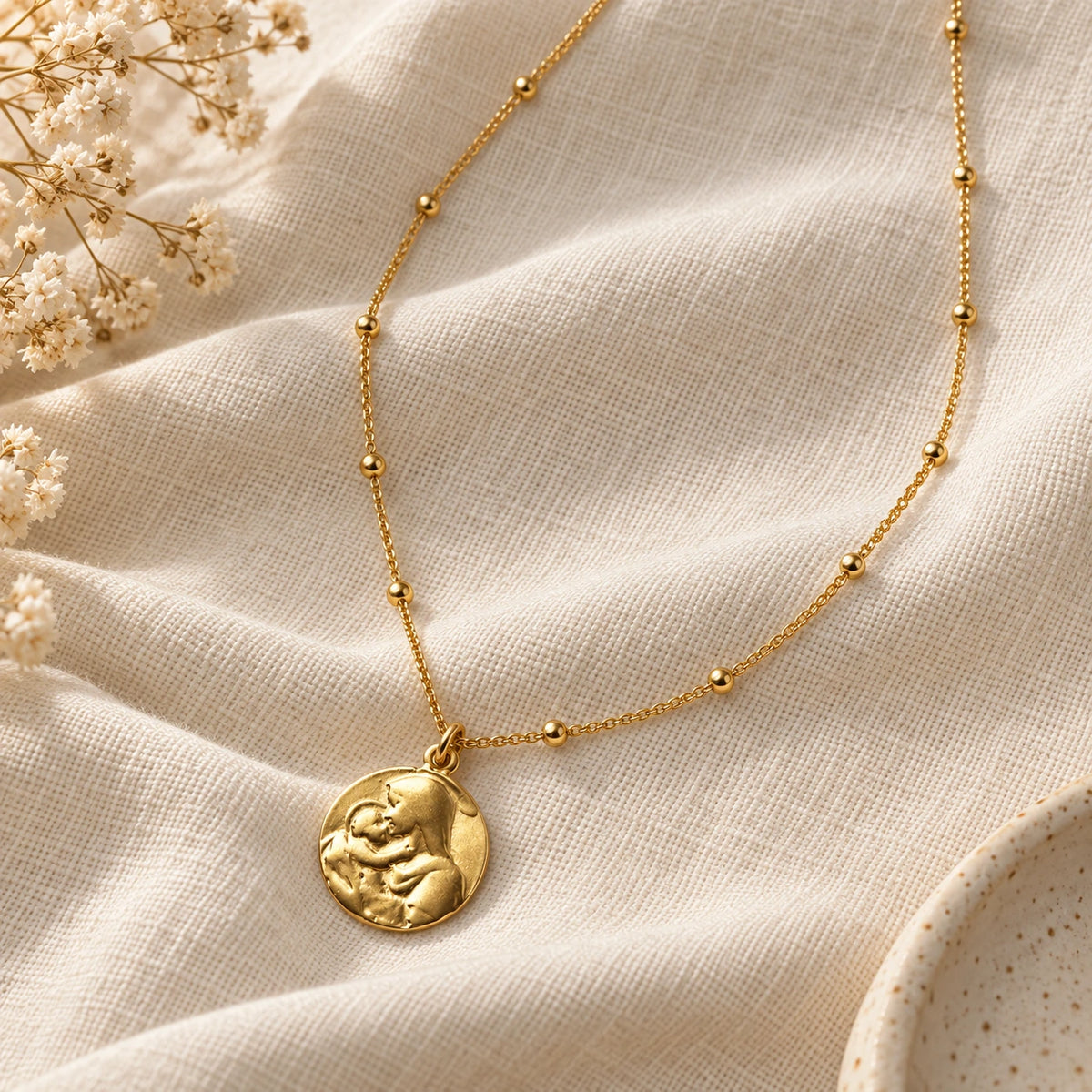 Mother Mary Necklace laid flat on linen
