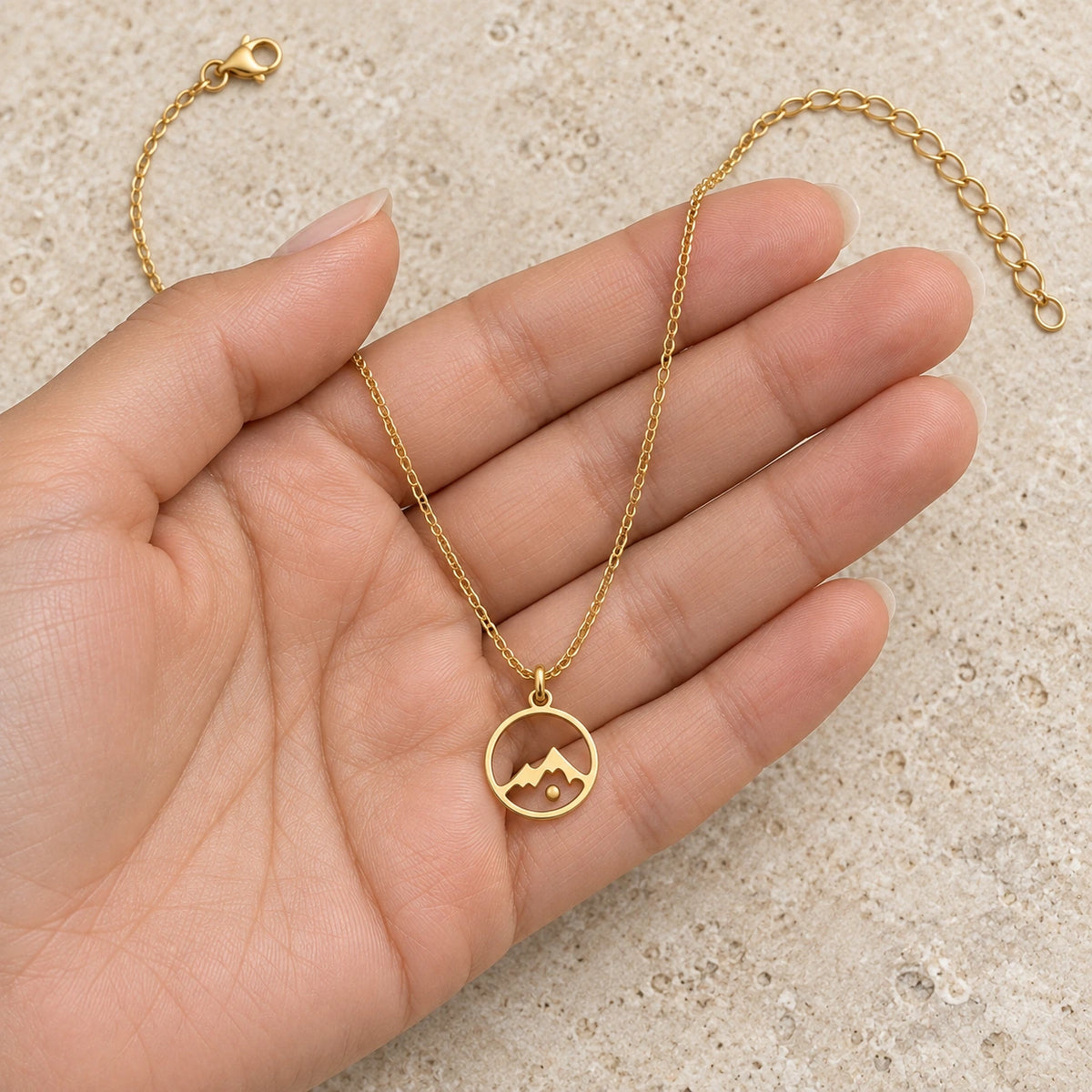 Mustard Seed Necklace held in hand, showing its true scale