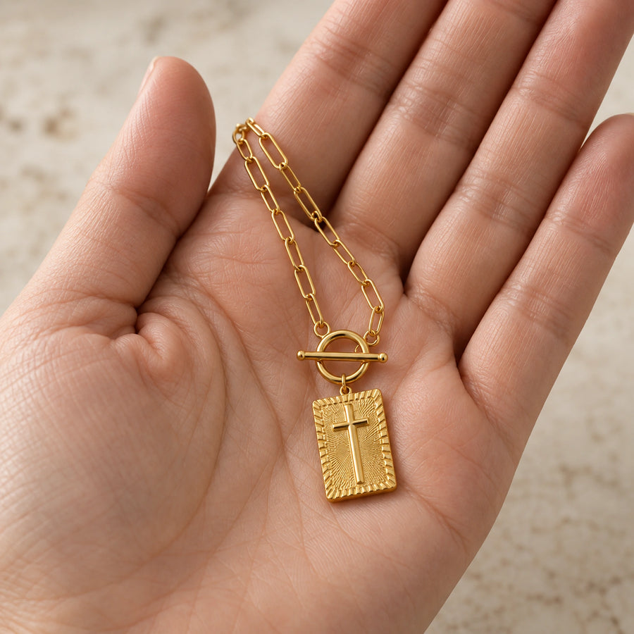 The Nail Cross Necklace shown for scale