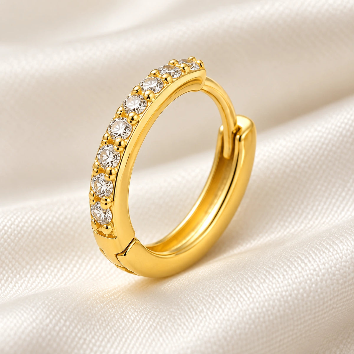 Close-up of the Amada Pave Huggie Earrings showing its detail and finish.