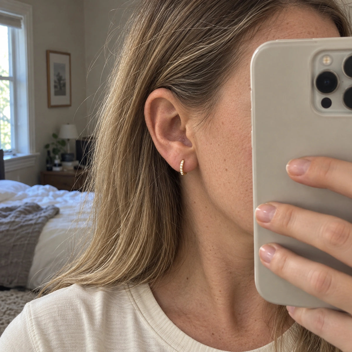 Amada Pave Huggie Earrings worn in an everyday setting.
