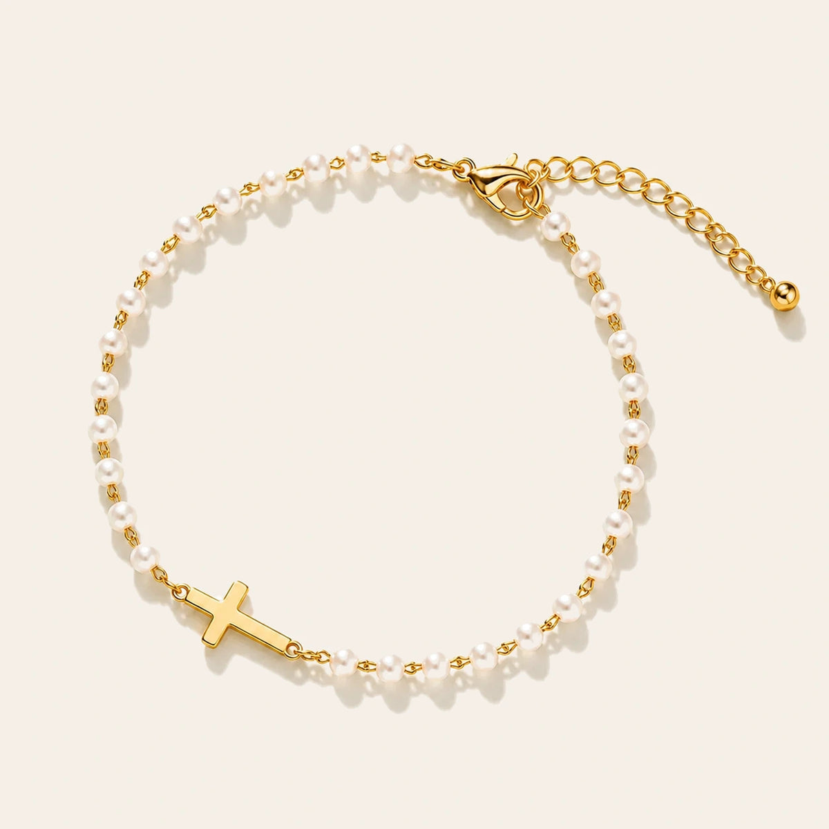 Amada Pearl Cross of Grace Bracelet on ivory background