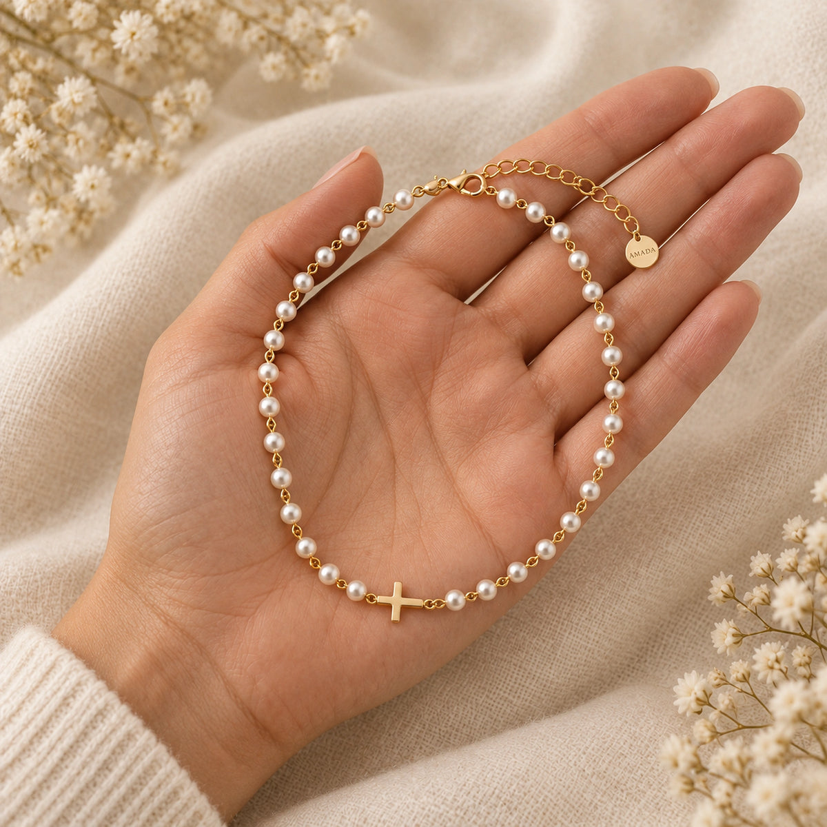 Pearl Cross of Grace Necklace held in hand to show its size.
