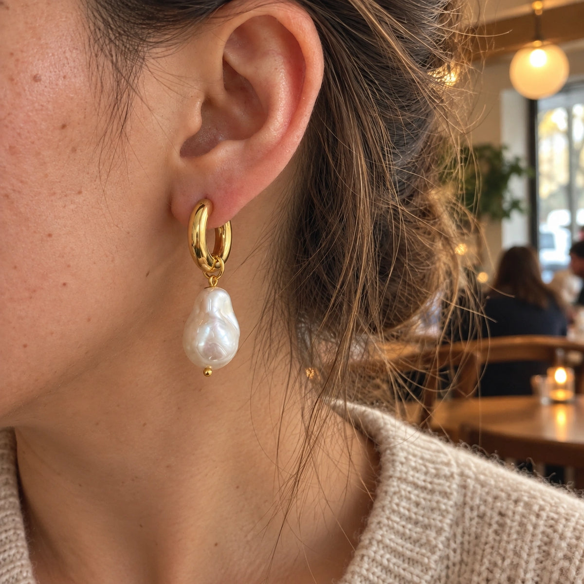 Amada Faux Pearl Drop Earrings worn by a woman, shown from another angle.