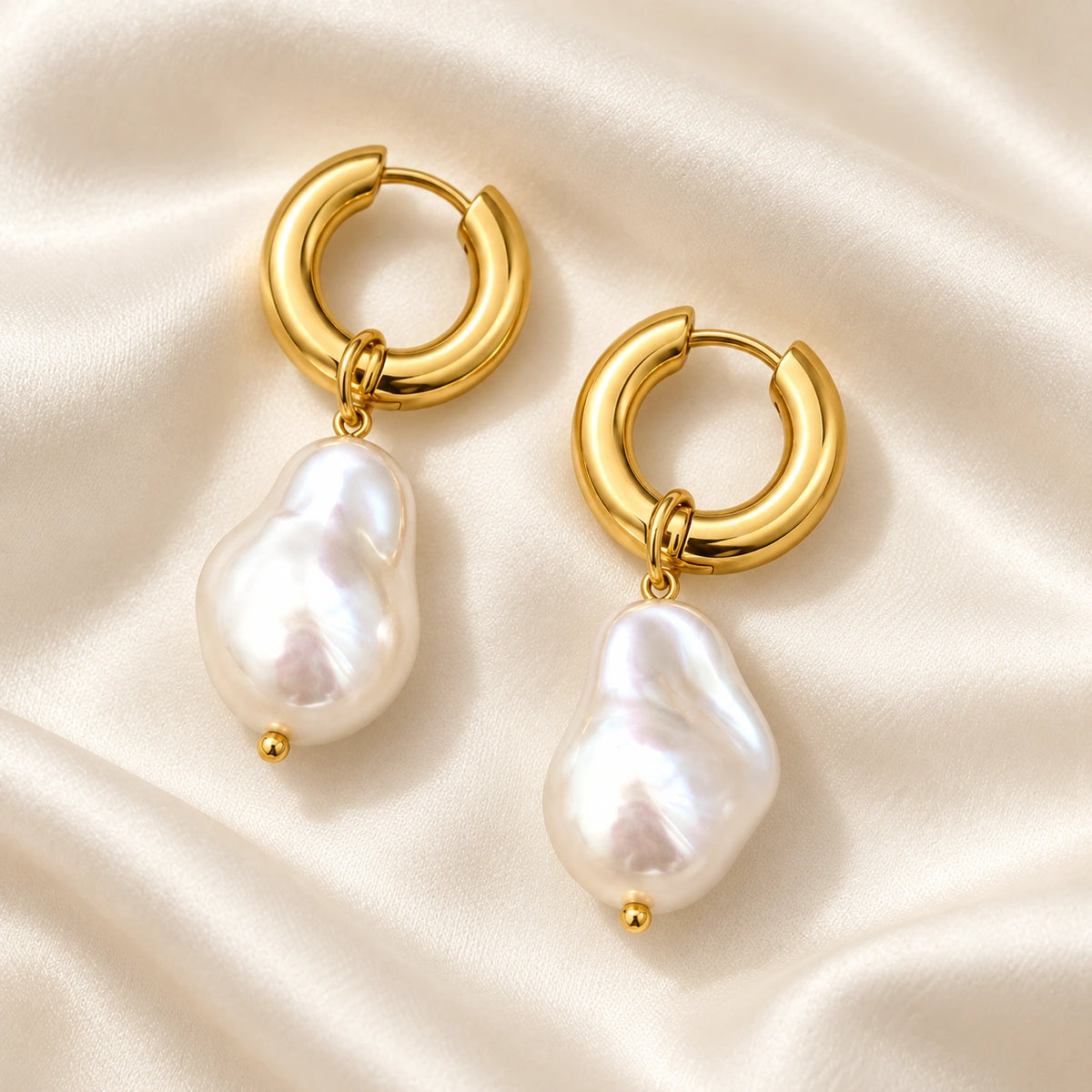 Amada Faux Pearl Drop Earrings laid flat on fabric.