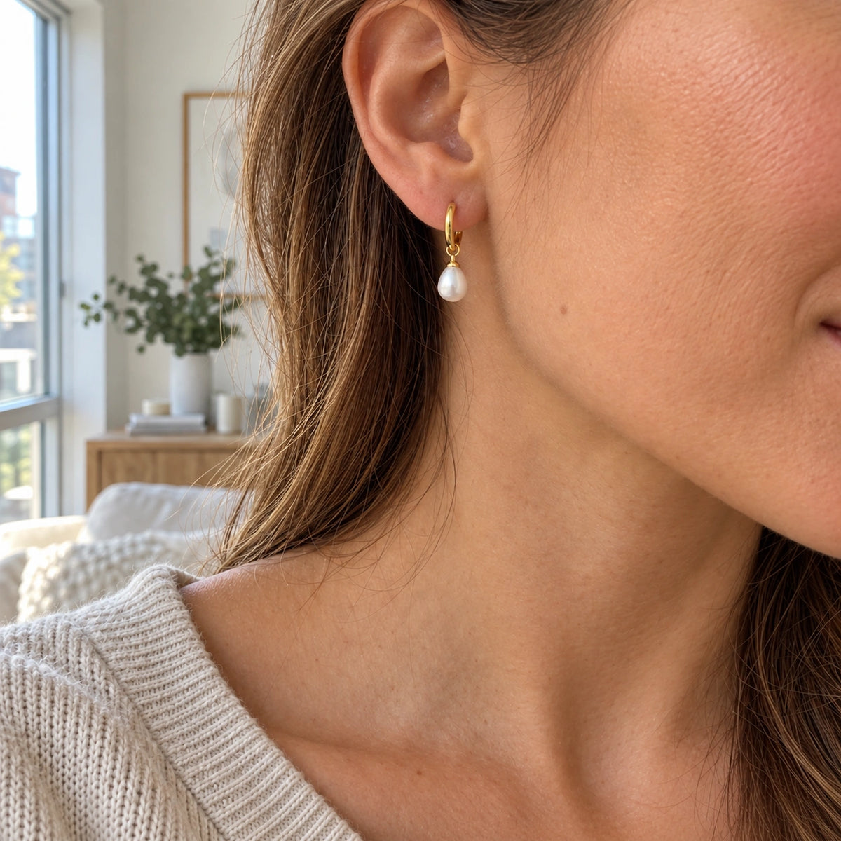 Amada Petite Faux Pearl Huggie Earrings worn in an everyday setting.