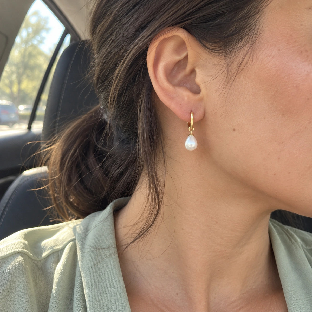 Amada Petite Faux Pearl Huggie Earrings worn in an everyday setting.