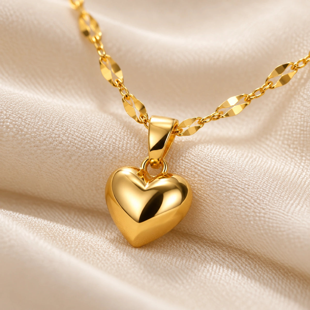 Close-up of the Amada Puffy Heart Necklace showing its detail and finish.