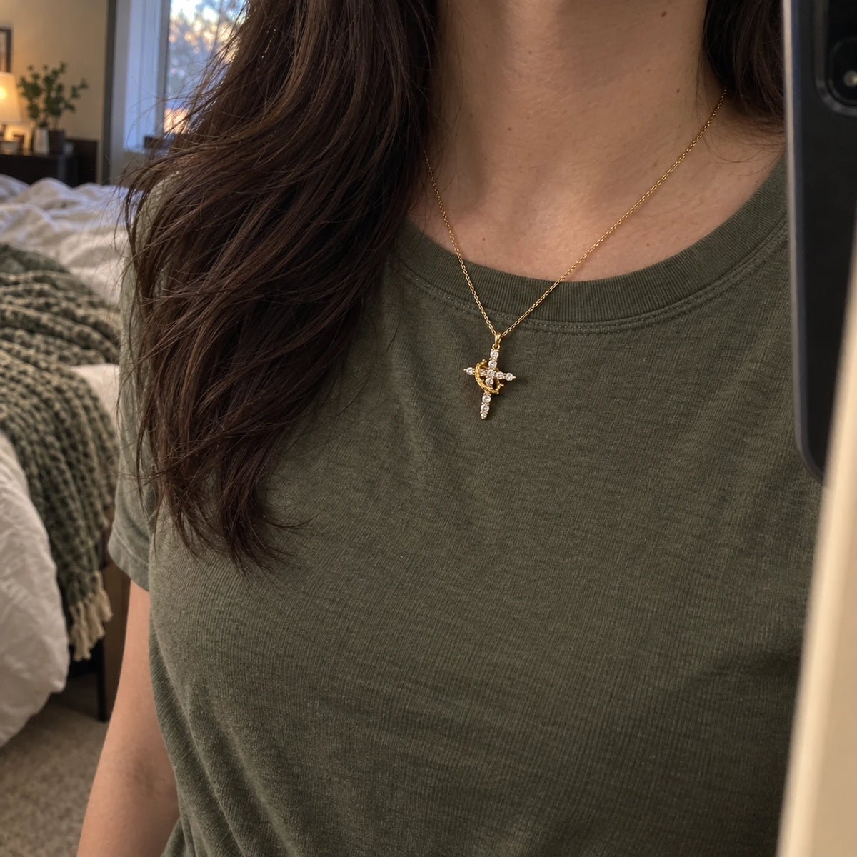 Rotating Crown Cross Necklace worn in everyday life