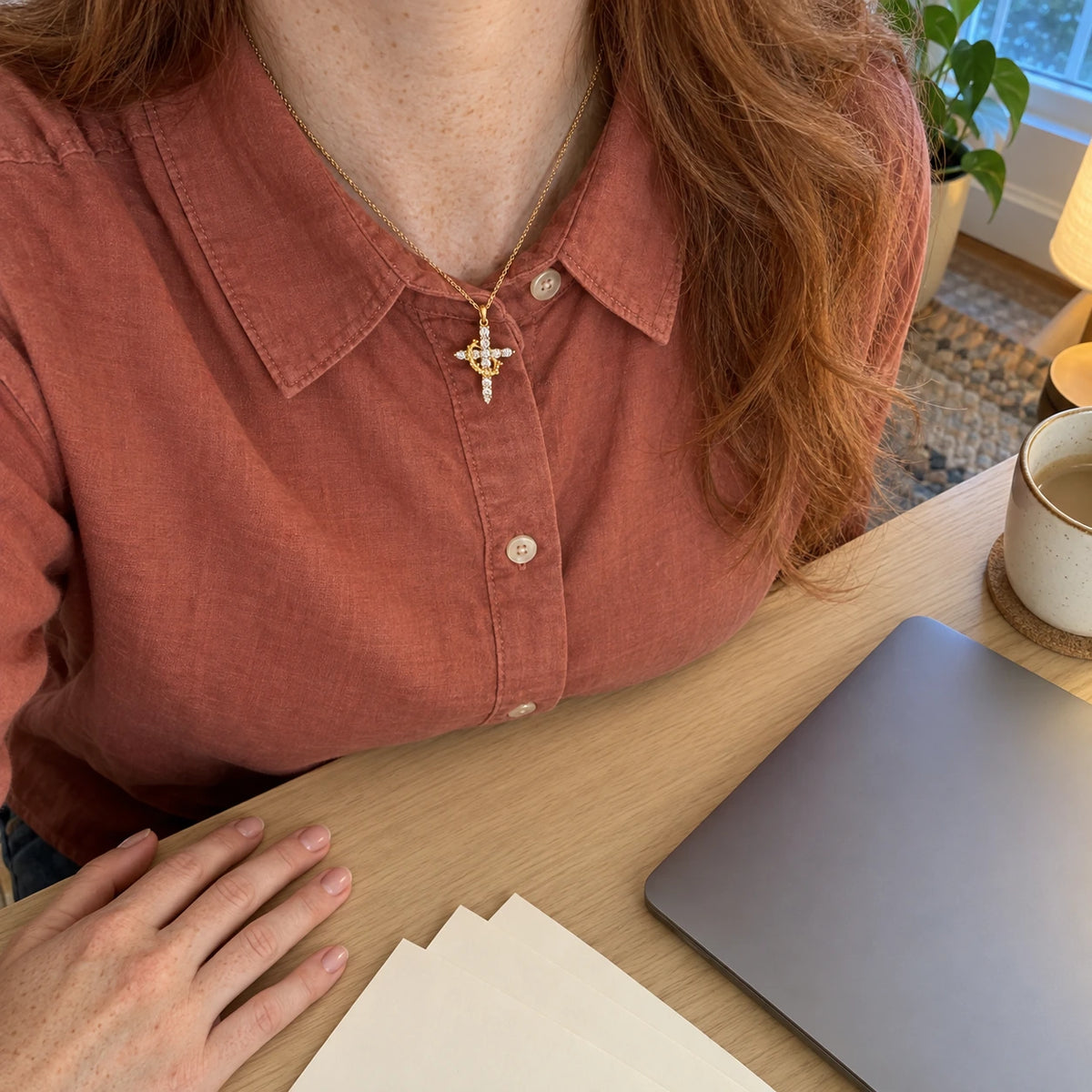 Rotating Crown Cross Necklace worn, first-person view