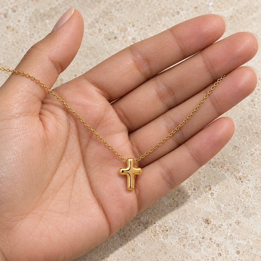 The Bold Cross Necklace shown for scale