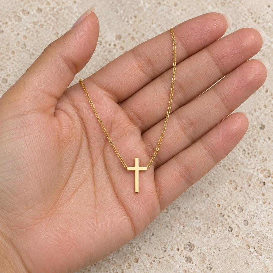 The Classic Cross Necklace shown for scale