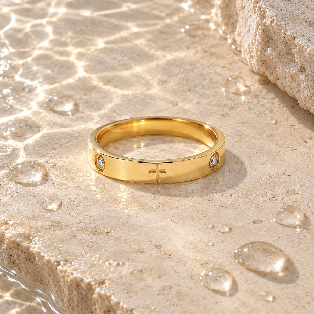 The Cross Ring with water droplets on stone